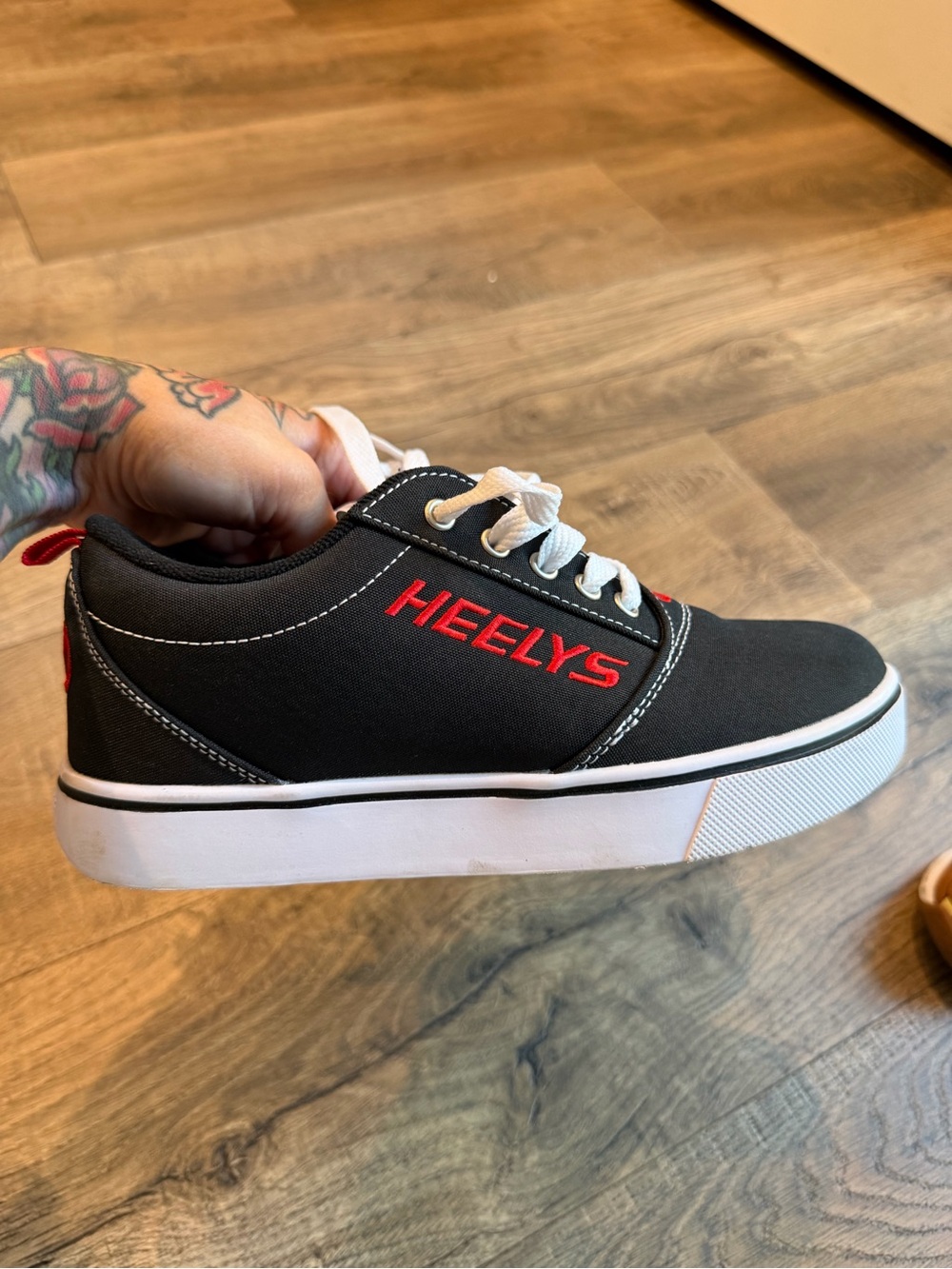 Heelys Kids Black Sneakers with Red Logo and White Sole